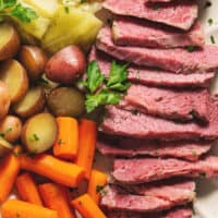 slow cooker corned beef with vegetables on a platter