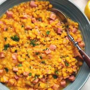 bowl of split pea soup with spoon