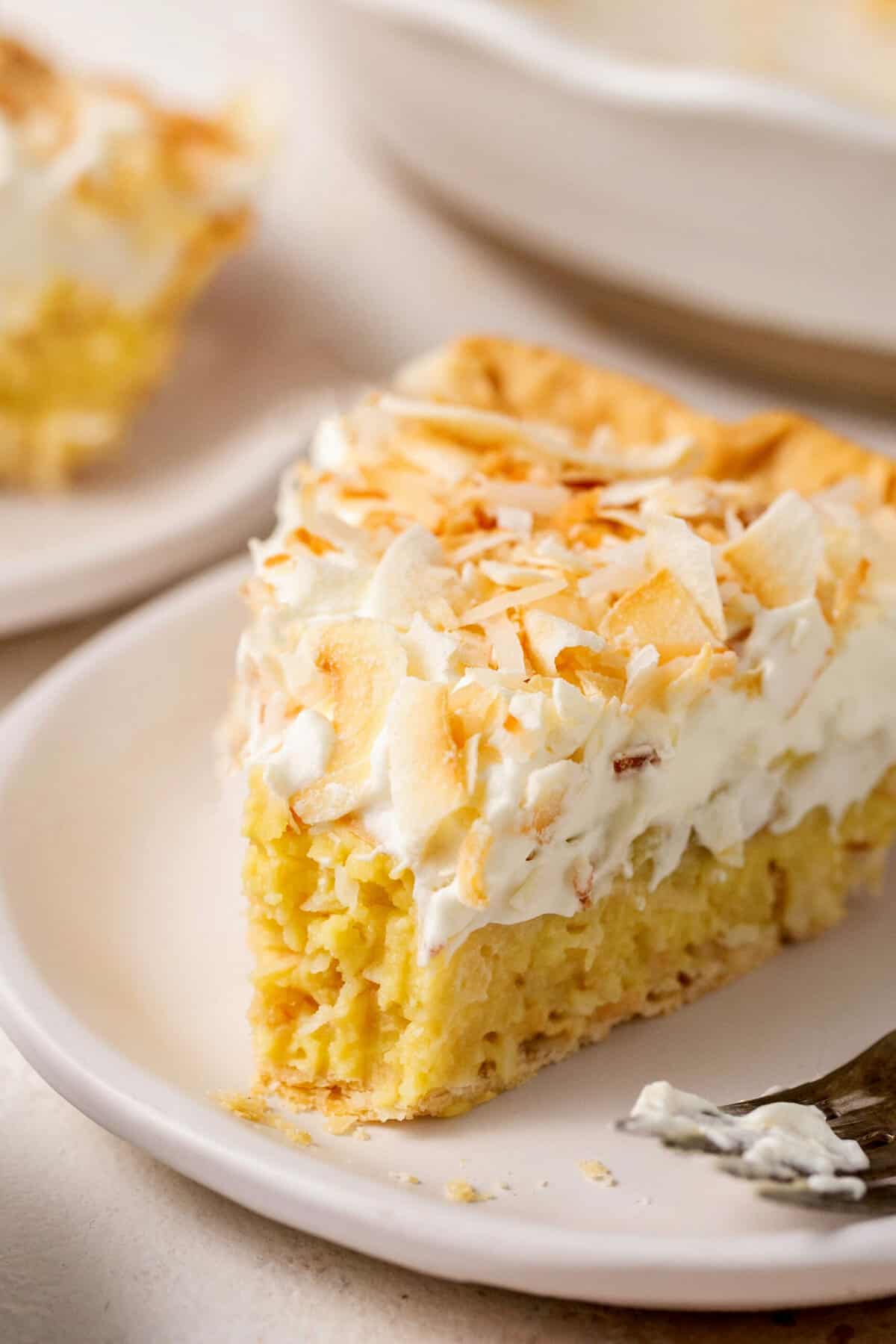 up close slice of coconut cream pie