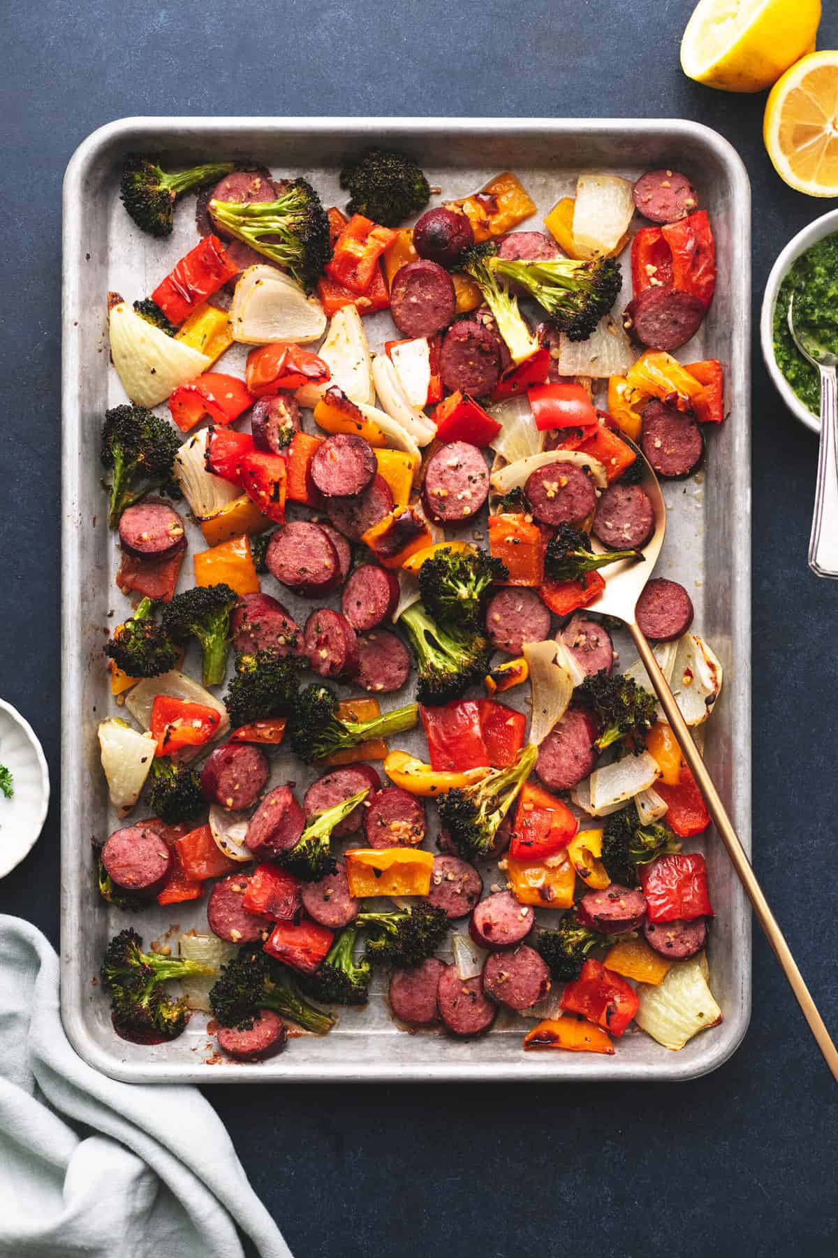 sheet pan with cooked sausage and vegetables