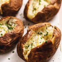 instant pot baked potatoes with melting butter and herbs