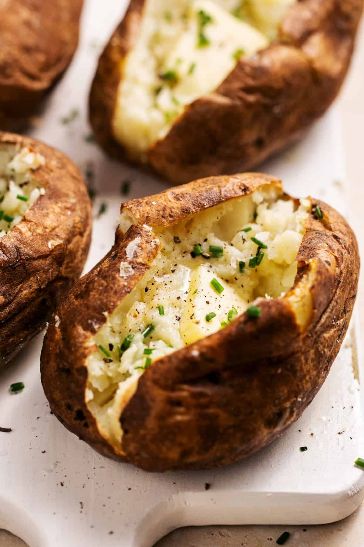 air fryer potatoes with melting butter and herbs