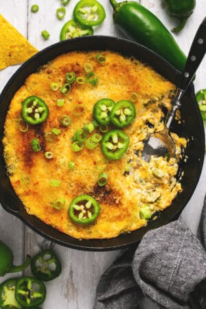 cheesy jalapeno dip in pan with spoon