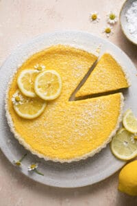 overhead view of lemon tart with single piece cut out