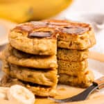 stack of banana pancakes with piece missing
