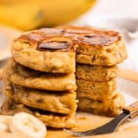 stack of banana pancakes with piece missing