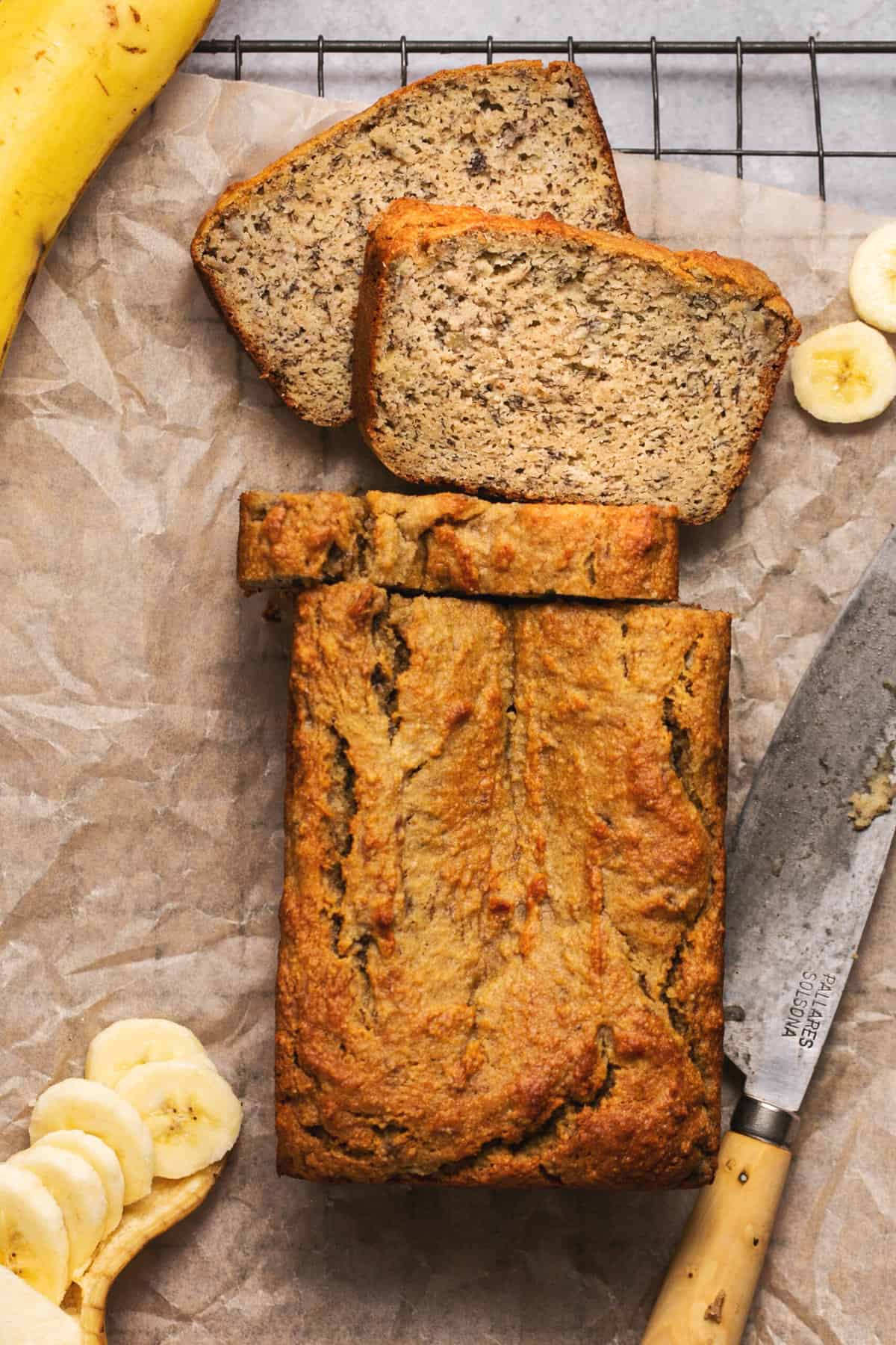 overhead view of sliced loaf of banana bread