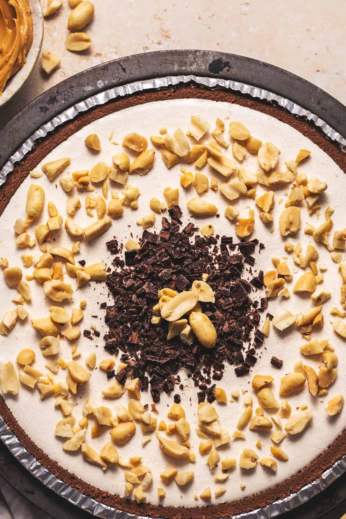 peanut butter pie with peanuts and chocolate shavings