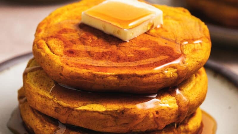 stack of pumpkin pancakes on plate