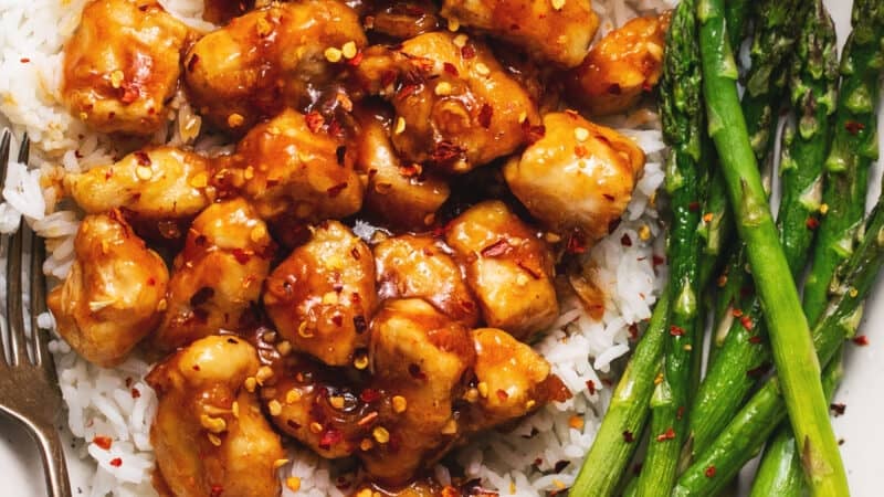 honey sriracha chicken over rice with roasted asparagus