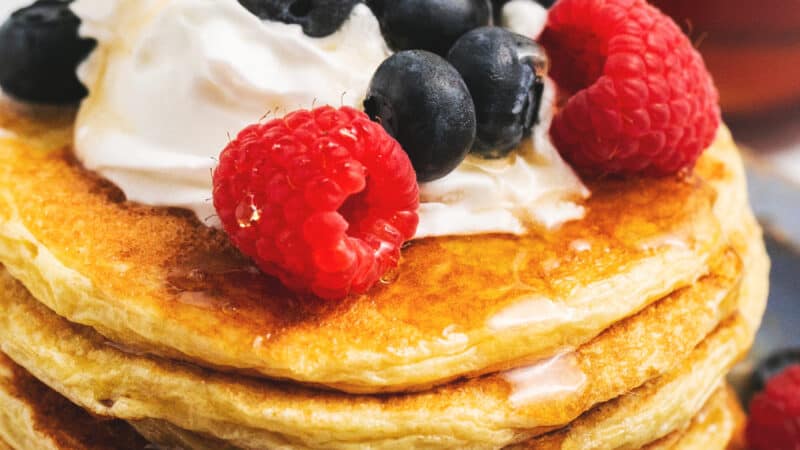 cottage cheese pancakes stacked on a plate