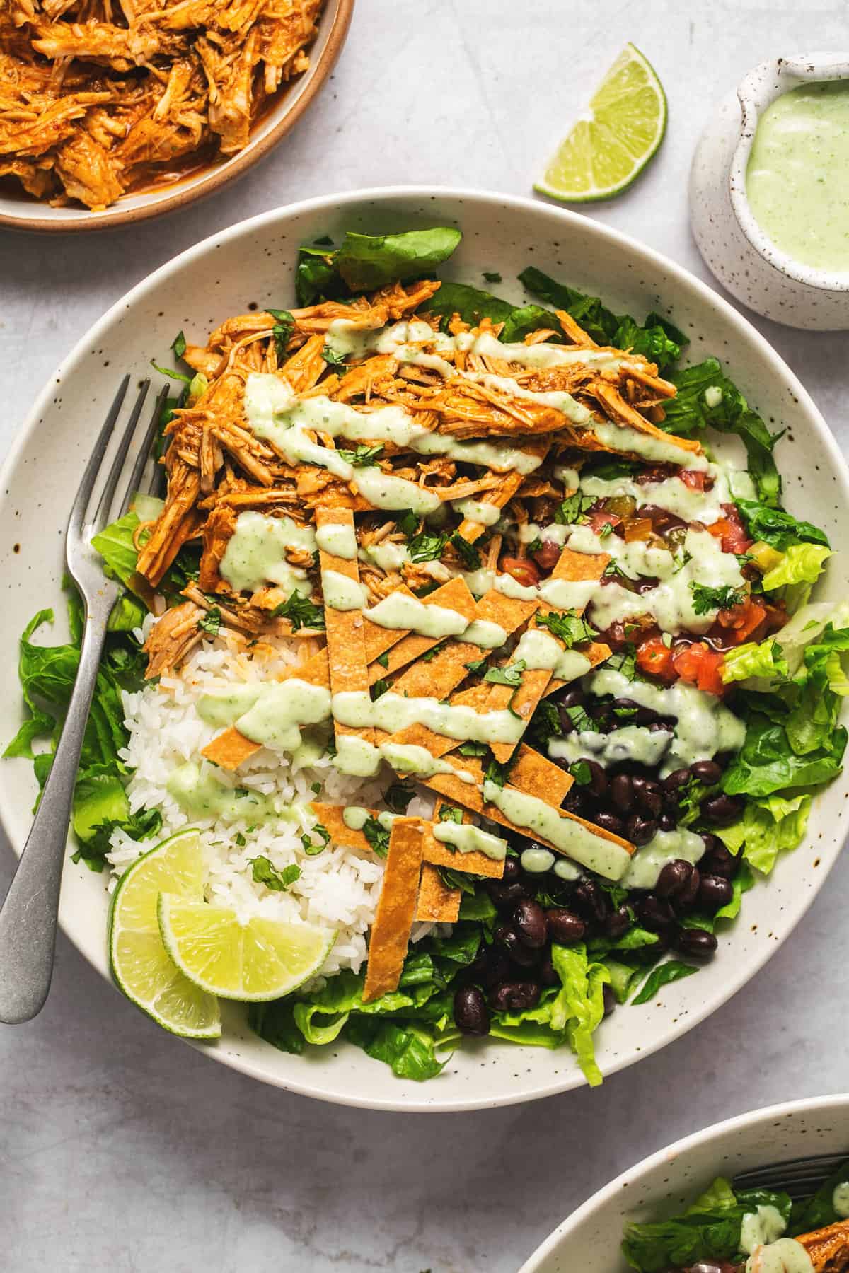 sweet pork salad in bowl with dressing drizzled on top