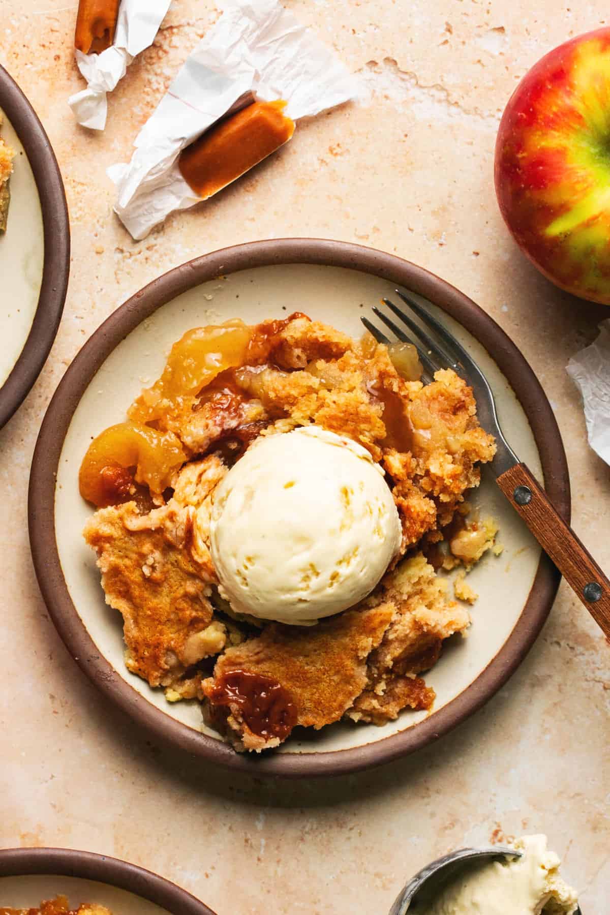 overhead view of caramel apple dessert on plate with fork