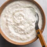 spoon in bowl of creamy sauce for prime rib