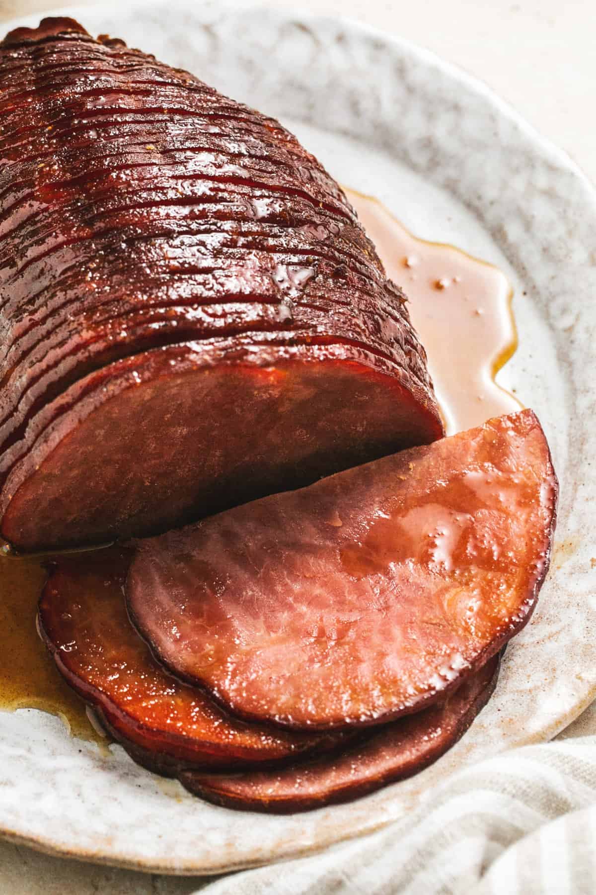 slow cooker glazed ham, sliced and resting on platter