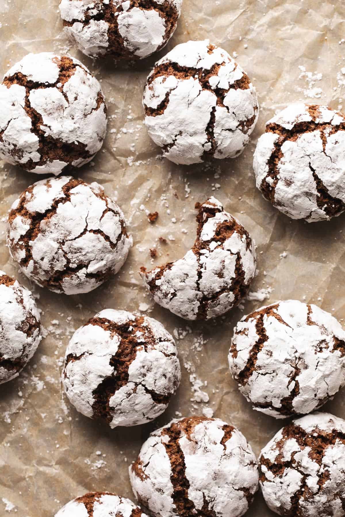 chocolate powdered sugar cookies on parchment paper