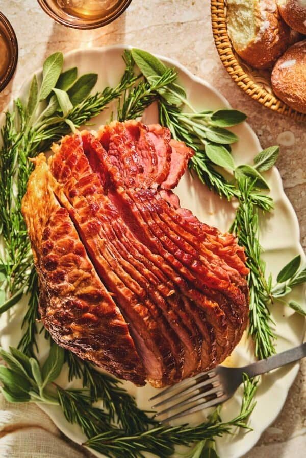 Overhead of crockpot ham with brown sugar glaze on a serving platter.