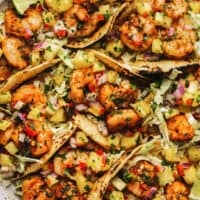 cilantro lime shrimp in taco shells with pineapple salsa