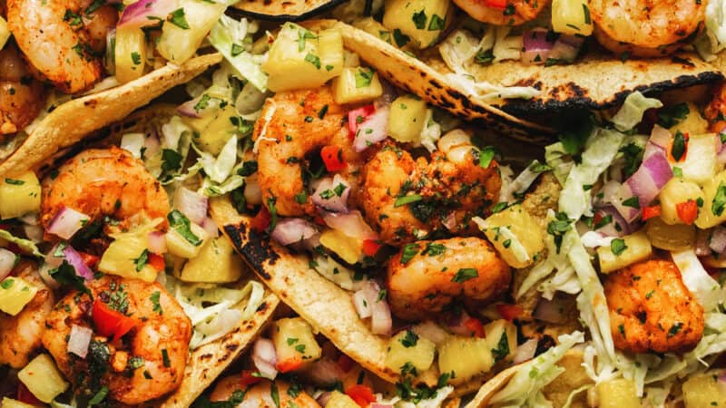 cilantro lime shrimp in taco shells with pineapple salsa