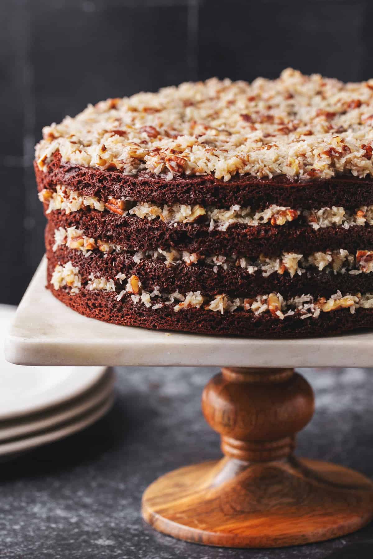 german chocolate layer cake on cake stand