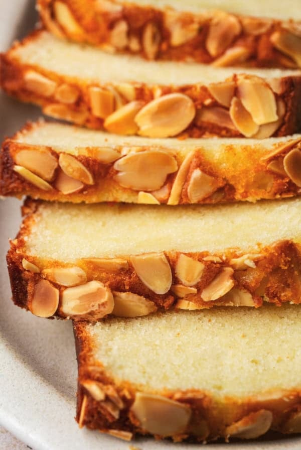 sliced almond cake with slivered almonds on top