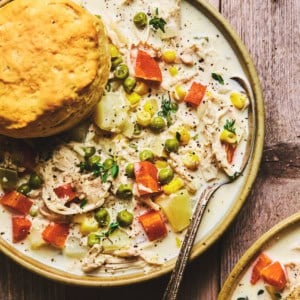 chicken pot pie soup in bowl with spoon
