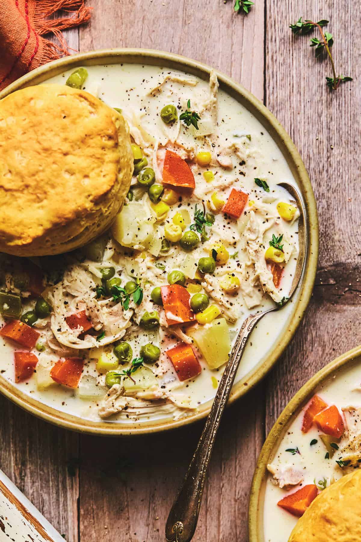 chicken pot pie soup in bowl with spoon.