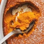 overhead view closeup of spoon scooping mashed carrots