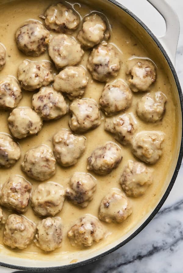 Overhead of Swedish meatballs in a skillet.