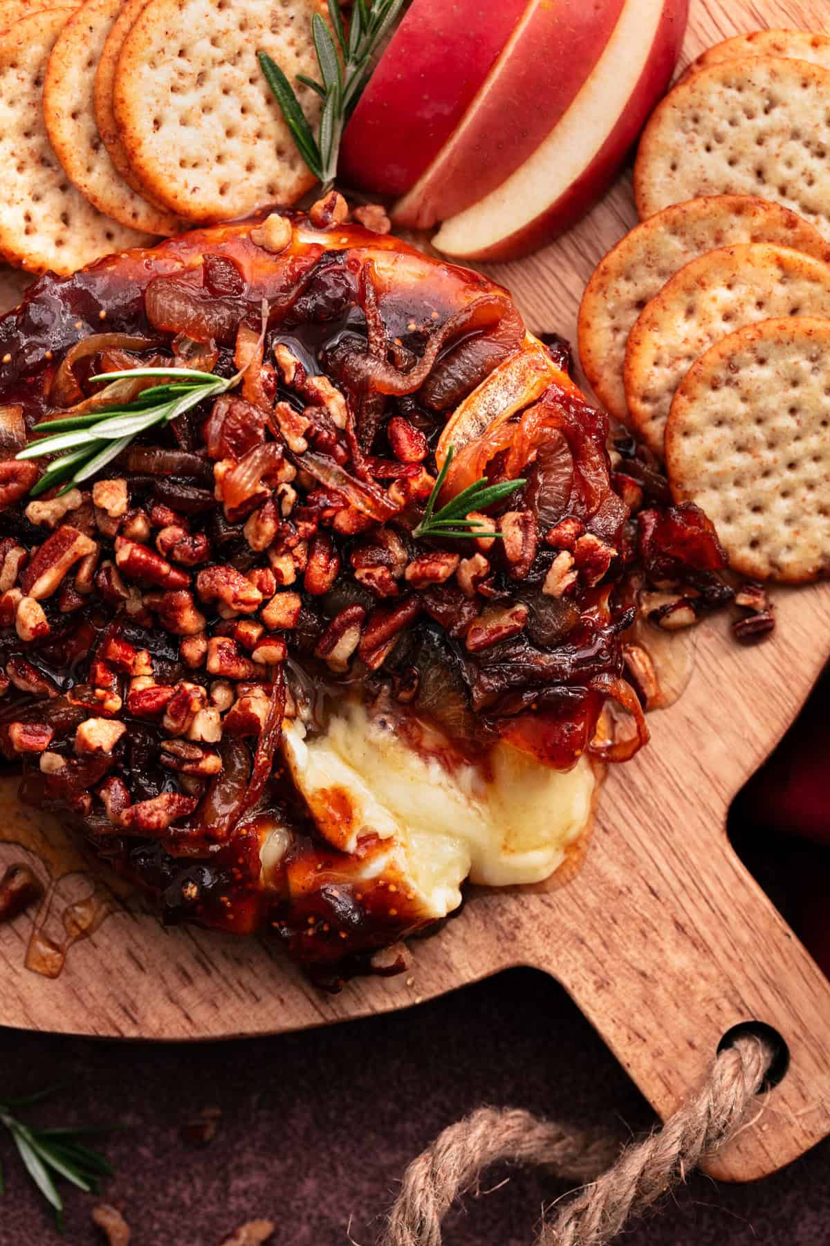 baked brie appetizer with nuts and fig jam served with apples and crackers 