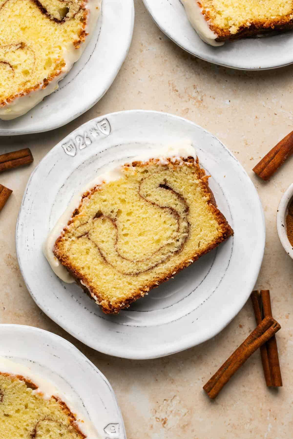 Overhead piece of cinnamon roll pound cake on a white plate.