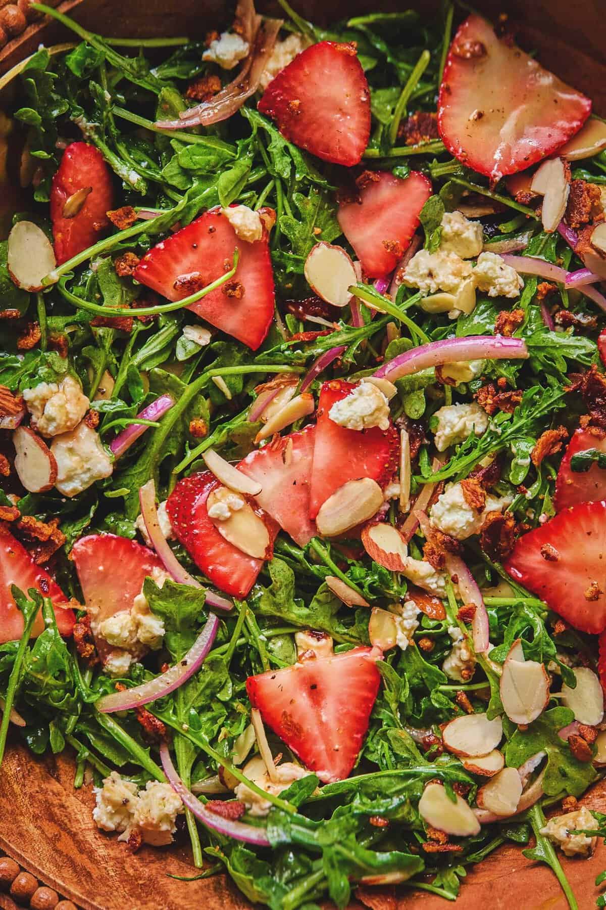 Close up overhead of strawberry arugula salad.